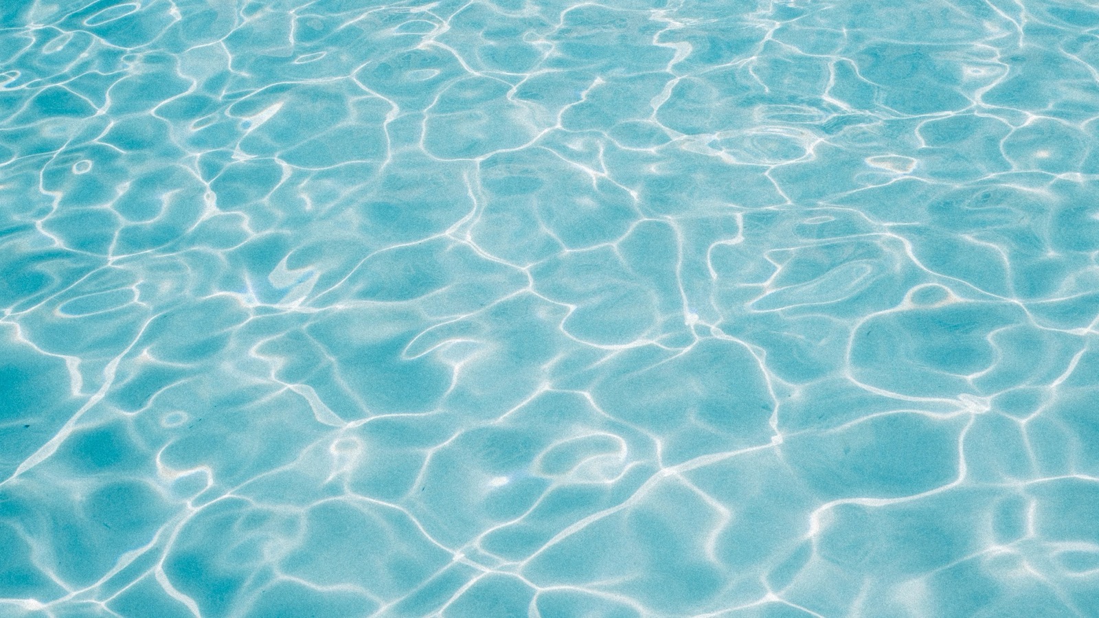 Sunlight rippling across clear water