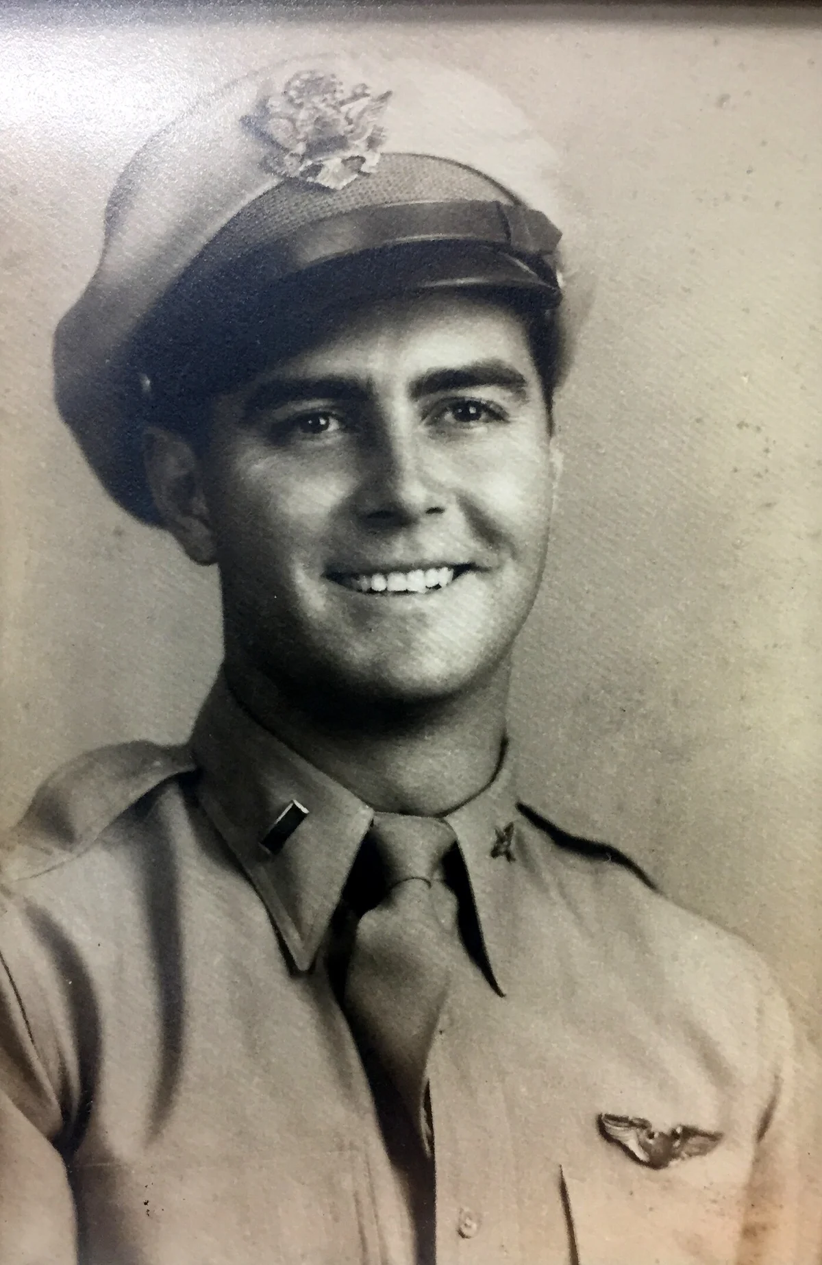 George Keller in Army Air Corps uniform: service cap with eagle insignia, lieutenant's bar on the collar, and pilot's wings on his chest